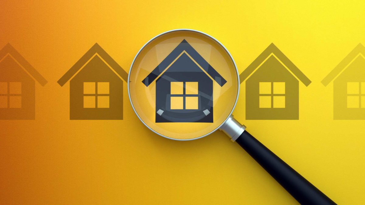 illustration of three houses with one under a magnifying glass signifying mcgrath share price on watch